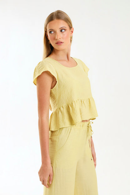 PEPLUM RUFFLE TOP / MISTED MARIGOLD